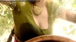 Indian bhabhi outdoor car wash displaying deep cleavag