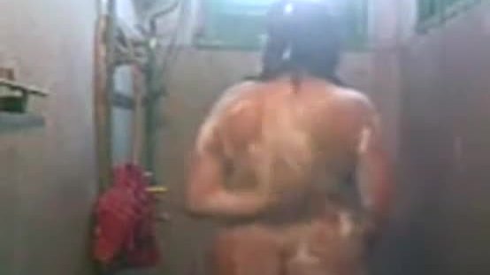 Chubby Aruna bathing nude
