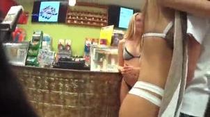 Two bubble butt bikini girlfriends at the counter